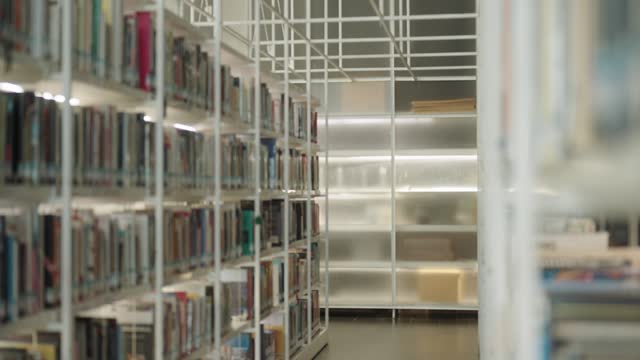 Several bookshelves are full of books at the library