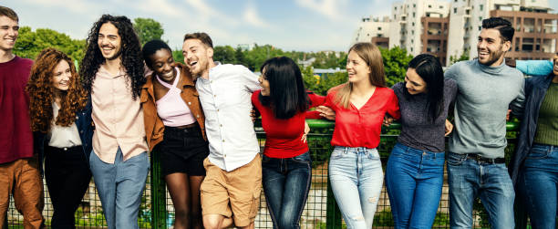 istock Multiracial Young Adults Sharing a Laugh in Urban Park 1972003399