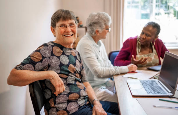 istock Cheerful senior female student looking at camera and smiling during a study session 1972025457