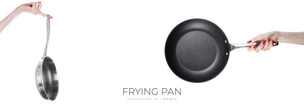 istock Female hand holding frying pan isolated on white background 1972055853