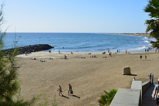 Gran Canaria, Canary Island of Spain - January 27, 2024: caucasian tourists enjoying a good time holidays in the winter at playa del Ingles beach