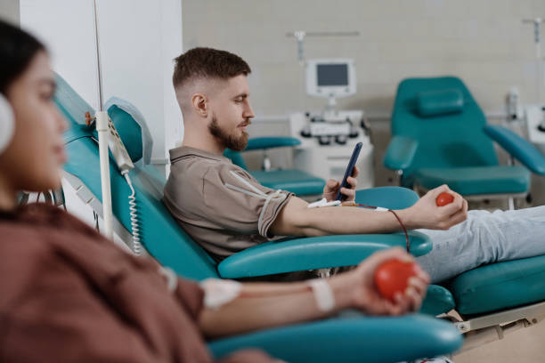 istock Young People Going Through Blood Donation Procedure in Medical Center 1972079143