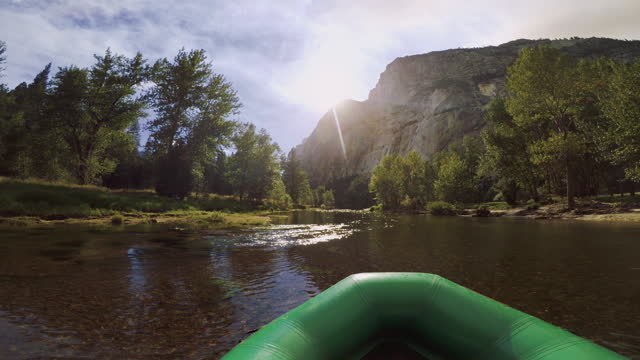 POV of a man rafting in Merced River of Yosemite