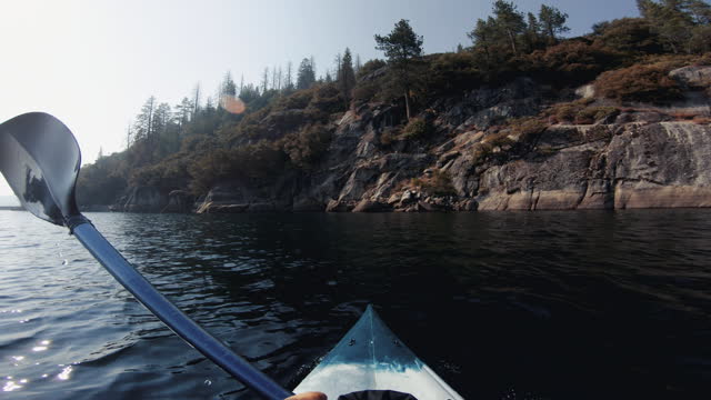 POV kayaking in a calm lake in Southwest USA