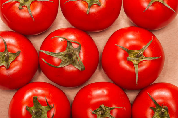 Sweet red pepper in section close-up on a wooden table, macro photography with selective focus