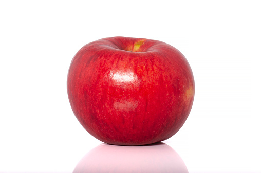 Red apple with a slice isolated. Apples cut out on white background. Red appl with clipping path. Full depth of field.