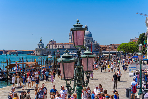 Old town of Italian City of Venice with crowd of people at famous Piazza san Marco on a sunny summer day. Photo taken August 7th, 2023, Venice, Italy.
