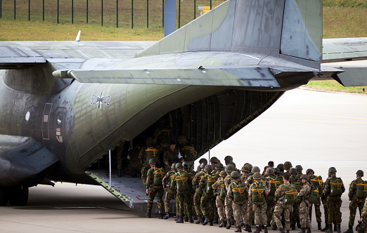 Paratroopers entering a German Air Force C-160 Transall transport plane on Eindhoven airbase. The Netherlands - September 17, 2016