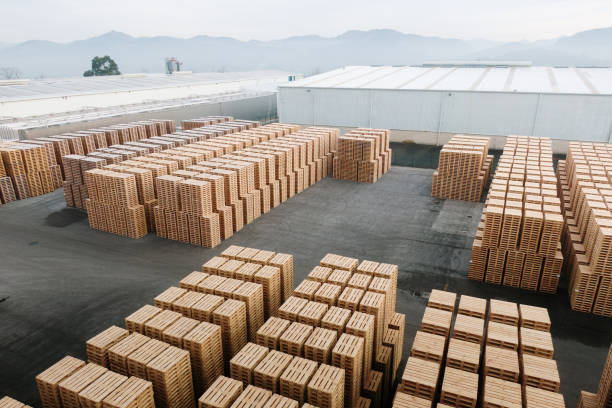 A large number of stacked pallets in an industrial area