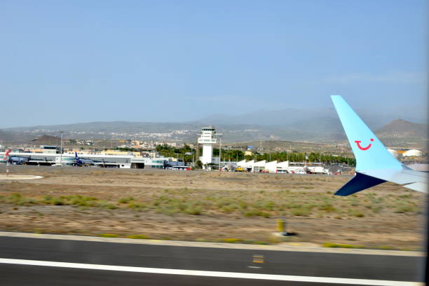 Santa Cruz ,Tenerife, island of Spain - January 28, 2024: from Gran Canaria stopover lift off departure at Tenerife airport towards Brussels Airport, Tui Airways airplane wing logo