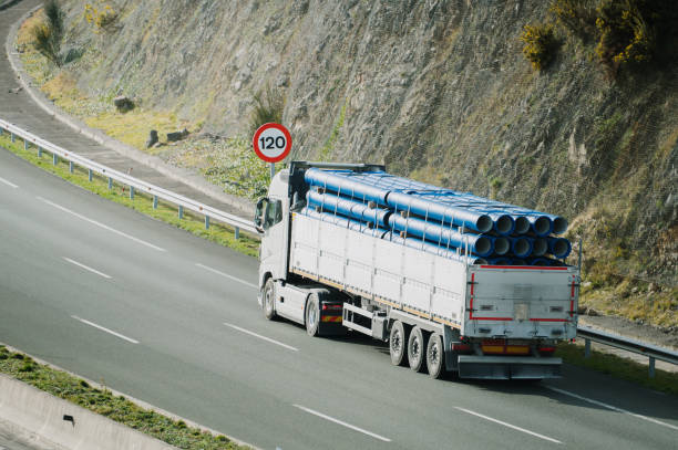 istock Truck transporting PVC pipes 1972253258