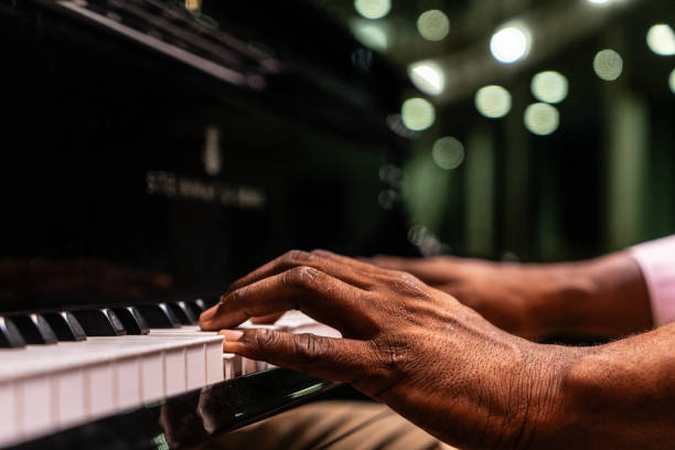 istock Close-up of a man's hand playing piano 1972294921