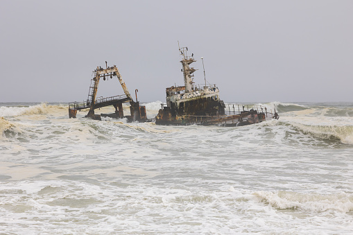 Shipwreck Zeila in the crashing waves near Swakopmund on Namibia Skeleton Coast