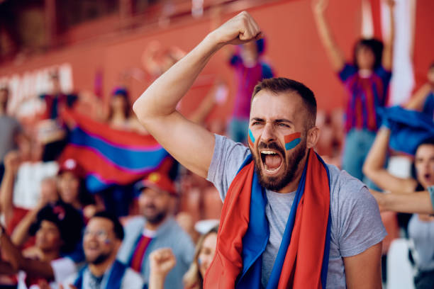 istock Passionate sports fan shouting during a match at the stadium. 1972317507