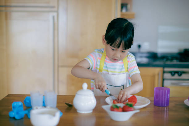 istock young  girl was preparing food at home kitchen 1972320168