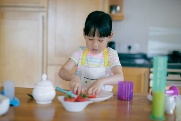 istock young  girl was preparing food at home kitchen 1972320176