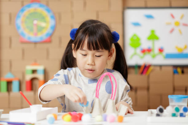 istock young girl making craft at home 1972321794