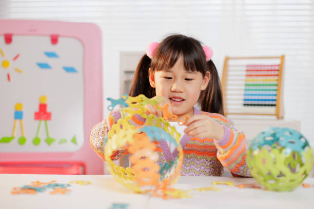 istock young girl making craft at home 1972321807