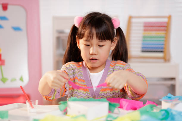 istock young girl making craft at home 1972322747