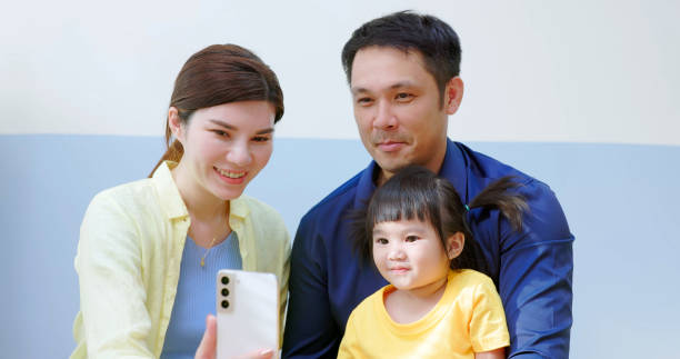 istock Asian parent accompany kid mobile 1972327804