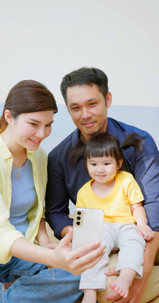 istock Asian parent accompany kid mobile 1972337707