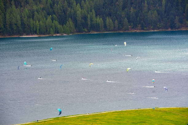 People doing kitesurfing on a mountain lake, Switzerland