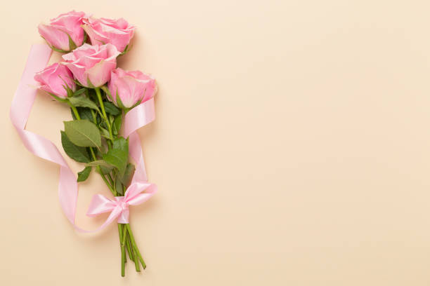 istock Pink roses on color background, top view. Valentines day concept 1972358243