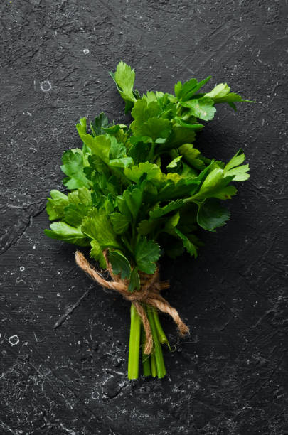 istock Fresh green parsley on the table. Top view. 1972372070