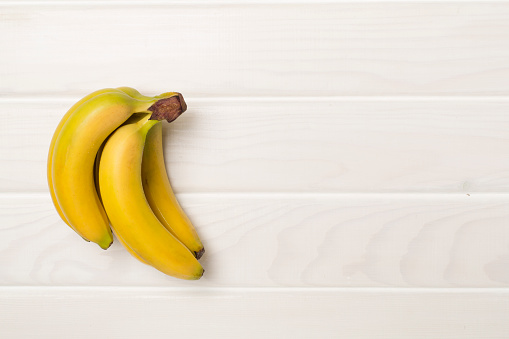 Ripe yellow big bananas isolated on white background. File contains clipping path