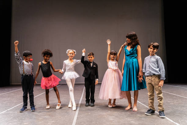 istock Children actors performing at stage theater 1972384775