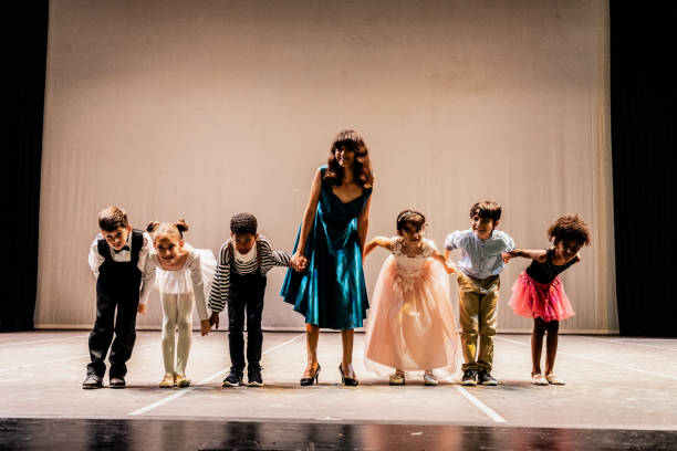 istock Children thanking the audience after performance at stage theater 1972390180