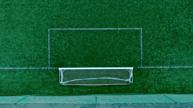 Experience the thrill as our drone captures the intensity of a penalty kick, weaving through the soccer field to showcase the precision and drama of a goal-scoring moment.