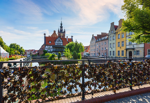 Gdansk, Poland - July 15, 2023: View of the Millers' Guild house and the Radunia Canal in Gdansk on a sunny summer day. Popular tourist attraction