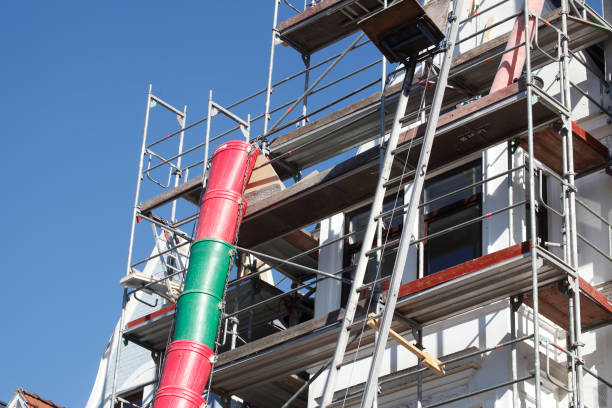 istock Scaffolding on an old building with colorful plastic buckets, downpipe, Bremen, Germany 1972469479