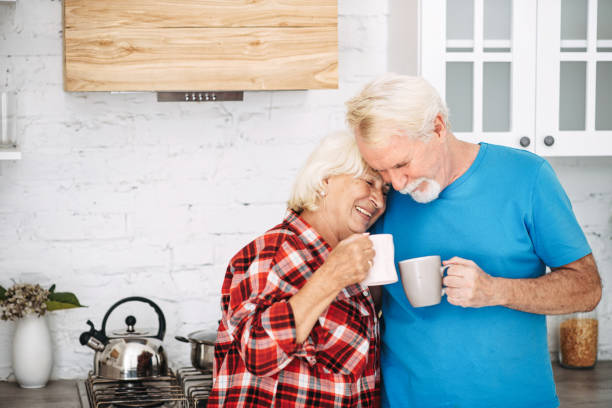 istock Senior couple drinks tea in the kitchen 1972491561
