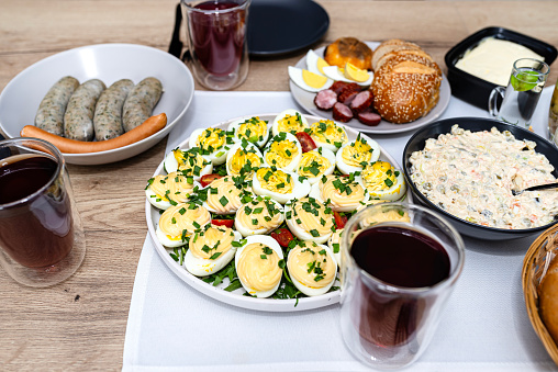 Traditional dishes from Poland for Easter breakfast, visible eggs with mayonnaise and stuffing.