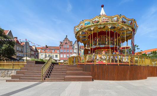 Carousel in old town of Gdansk. Retro carousel near the Motlawa river.