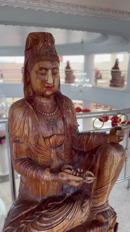 Large carved wooden goddess Kuan Yin