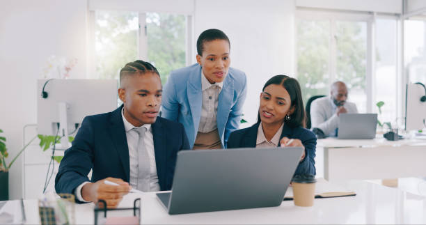 istock Business people, manager and employees with laptop, collaboration and internet with teamwork, cooperation and talk. Staff, women or man with a computer, online notification or planning with a project 1972530138