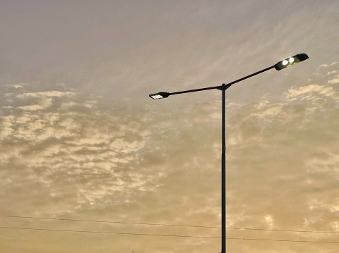 Lamp post with clouds background