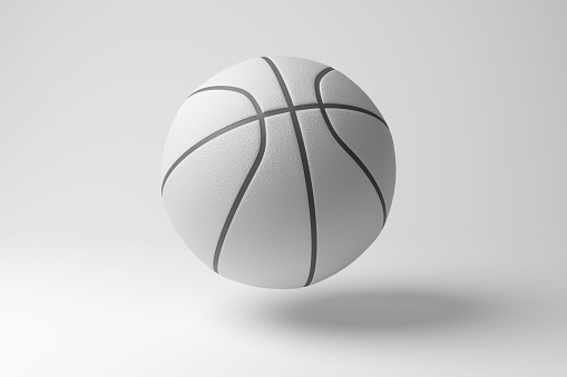 White basketball floating in mid air on white background in monochrome and minimalism. Illustration of the concept of team games and sports leagues