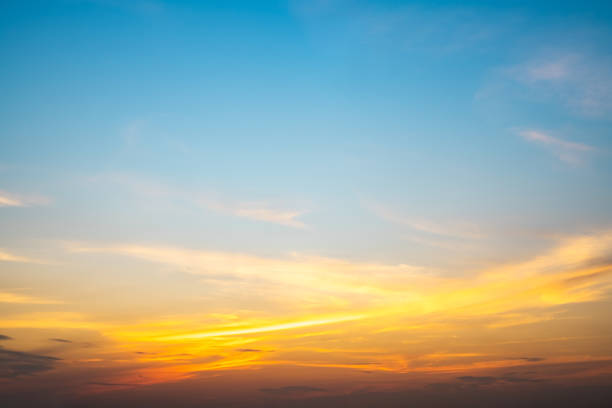 istock Beautiful , luxury soft gradient orange gold clouds and sunlight on the blue sky perfect for the background, take in everning,Twilight, Large size, high definition landscape photo 1972548310