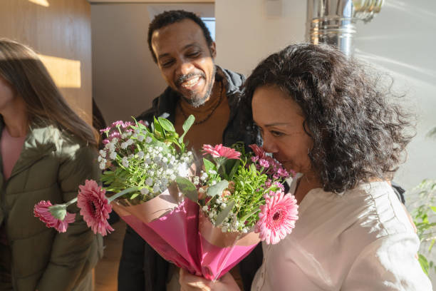 istock Mamily meeting together, greeting with flowers 1972571846
