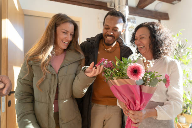 istock Mamily meeting together, greeting with flowers 1972571852