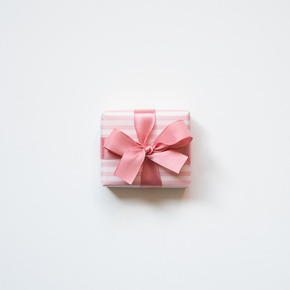 Pink stripe pattern gift box isolated on white background. top view