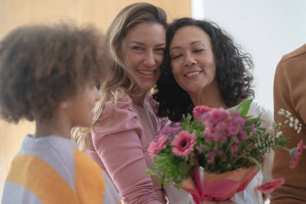 istock Mamily meeting together, greeting with flowers 1972578983