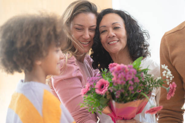 istock Mamily meeting together, greeting with flowers 1972579503