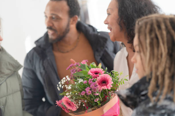 istock Mamily meeting together, greeting with flowers 1972583287