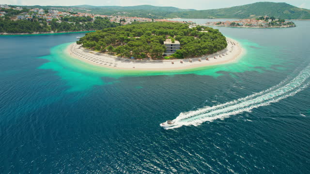 Aerial view of jet ski cruising in high speed near the Primosten beach, Croatia