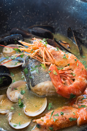 View of fresh seafood pot with shrimp, mussels and various types of clams.